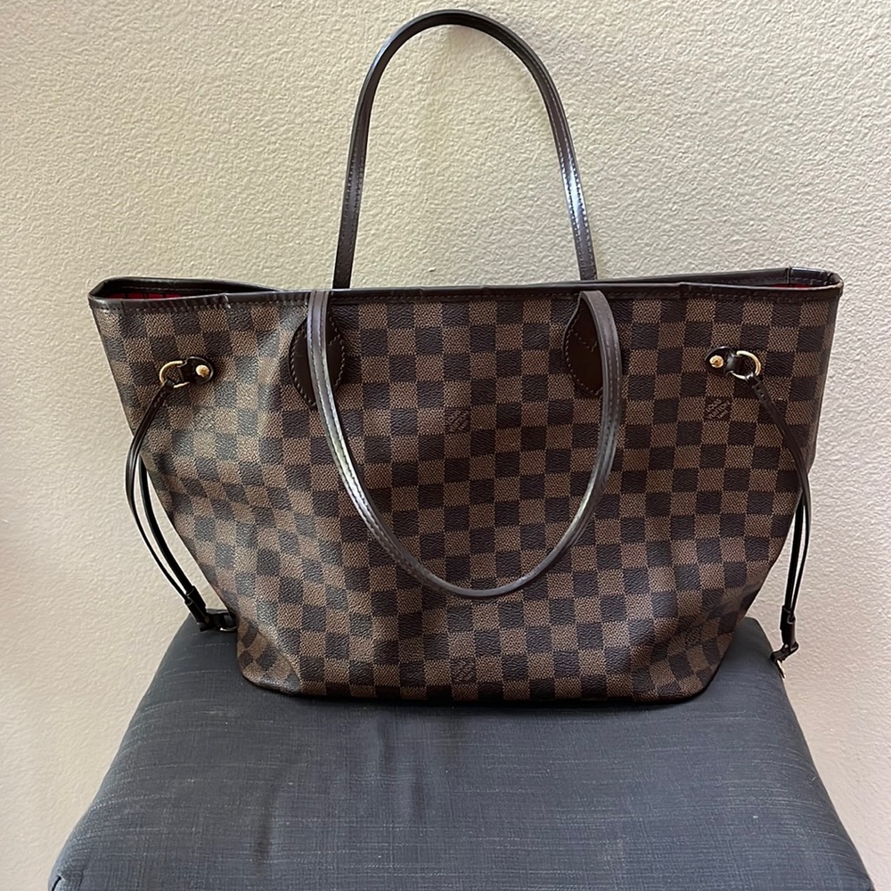Authentic Louis Vuitton Never full.  Date Code AR 4142 France 44th week 2012